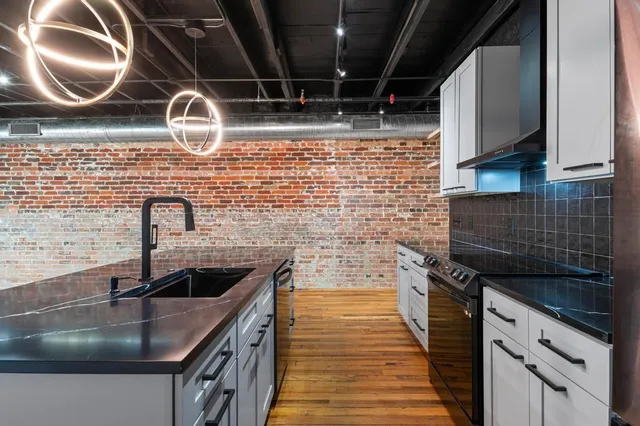 a kitchen with a sink and cabinets