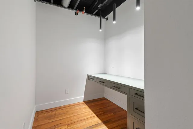 a view of wooden floor in an empty room