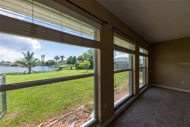 a bathroom with a granite countertop bathtub shower sink vanity and toilet