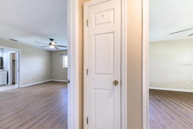 a bathroom with a granite countertop sink toilet a mirror a vanity and shower