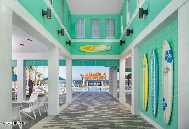 a view of a swimming pool with a lawn chairs