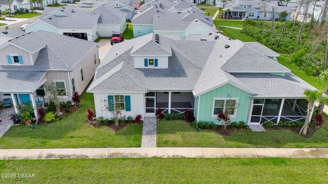 a kitchen with stainless steel appliances granite countertop a kitchen island hardwood floor sink stove and refrigerator