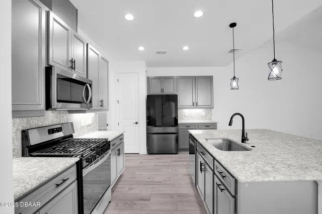 a view of an entryway with wooden floor