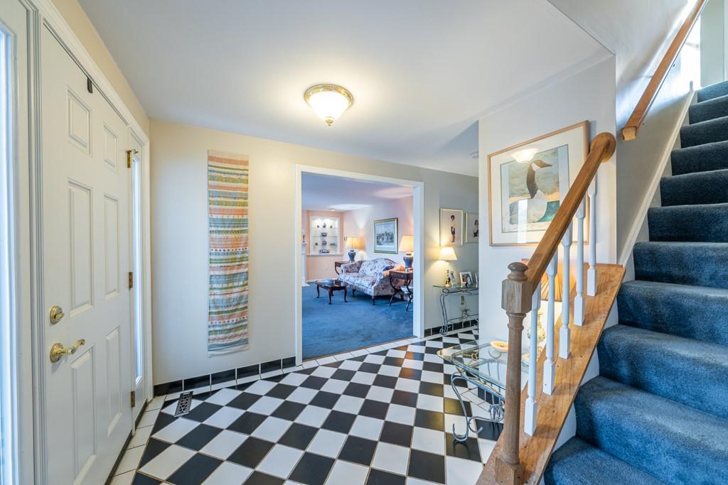 614 Ravencrest Road Pittsburgh, PA 15215 - Photo 3 of 25 a view of a hallway with wooden floor and stairs