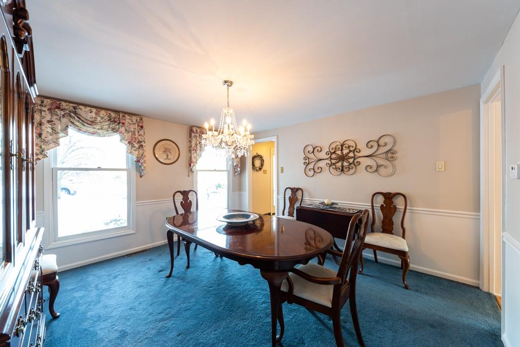 614 Ravencrest Road Pittsburgh, PA 15215 - Photo 7 of 25 a view of a dining room with furniture and chandelier