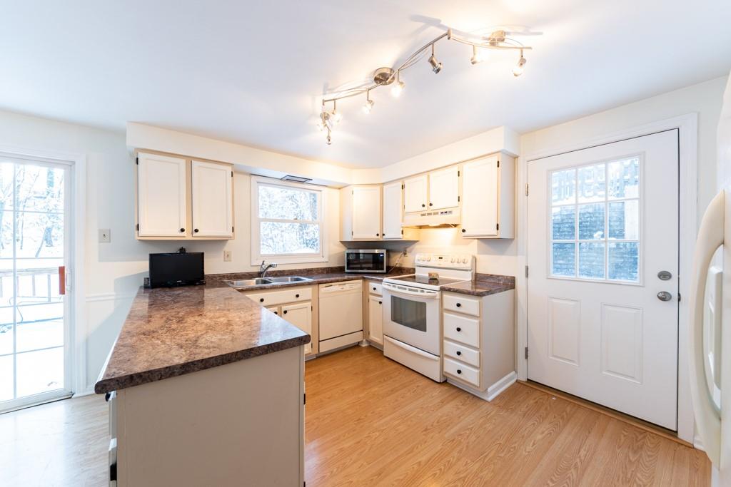 614 Ravencrest Road Pittsburgh, PA 15215 - Photo 10 of 25 a kitchen with stainless steel appliances granite countertop a stove sink and cabinets