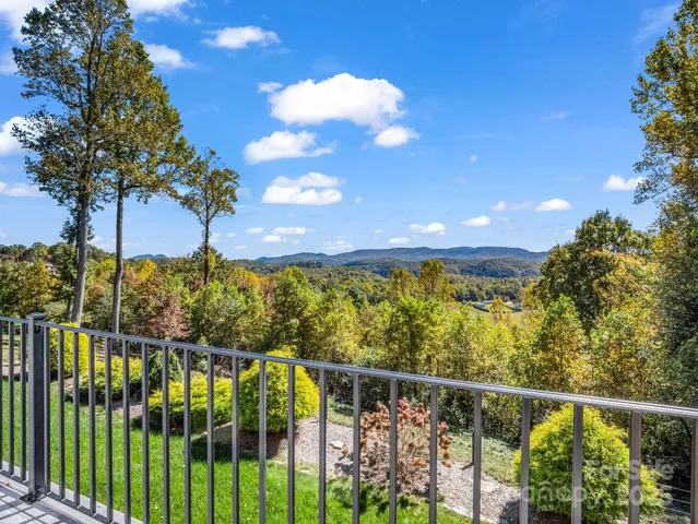 a view of balcony with furniture and city view