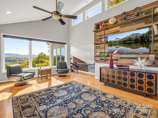 a living room with furniture a window and a table