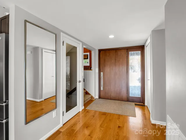 a kitchen with granite countertop a sink stainless steel appliances and cabinets