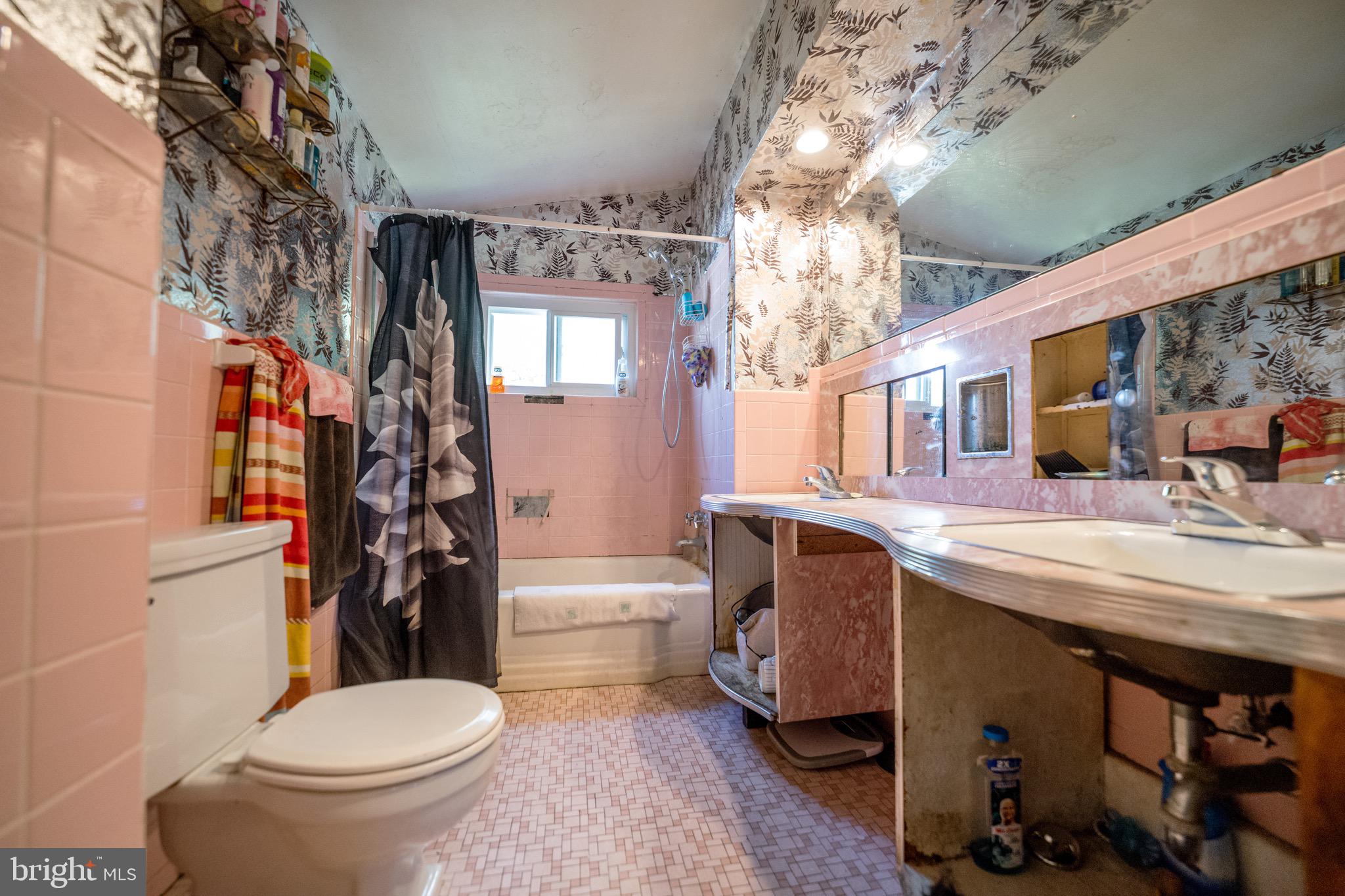 4125 Ronis Road Pikesville, MD 21208 - Photo 12 of 40 a bathroom with a sink toilet and shower