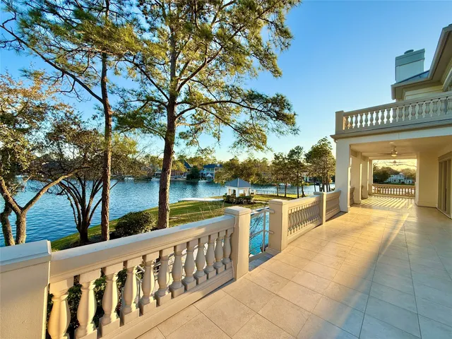 a view of a chairs and table in the balcony