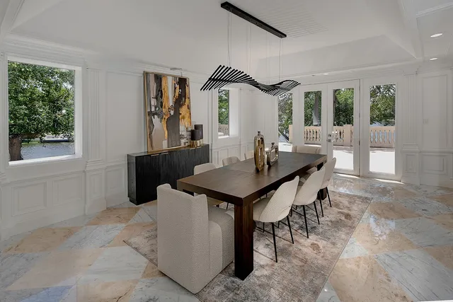 a dining room with furniture and window