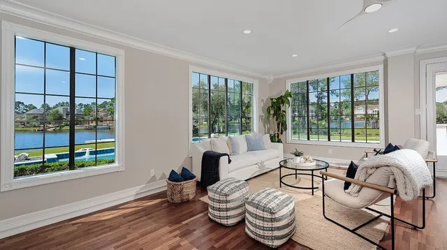 a living room with furniture and a large window