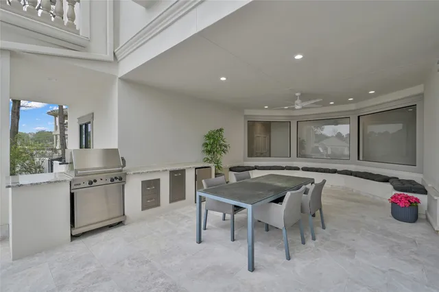 a kitchen with a table and chairs in it