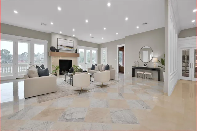 a living room with furniture and a fireplace