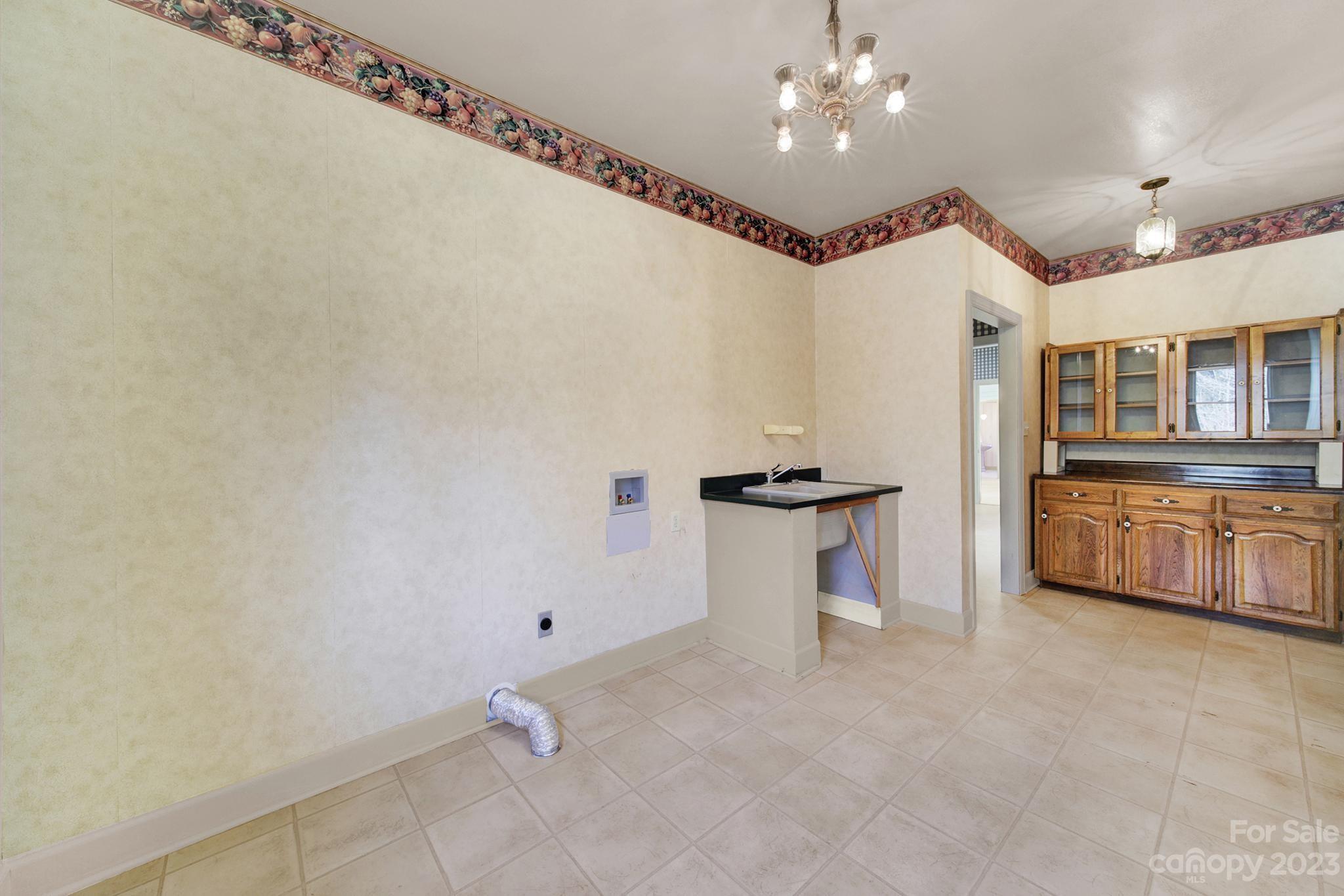 4594 Reid Road Rock Hill, SC 29730 - Photo 24 of 48 a view of a kitchen with dishwasher and white cabinets