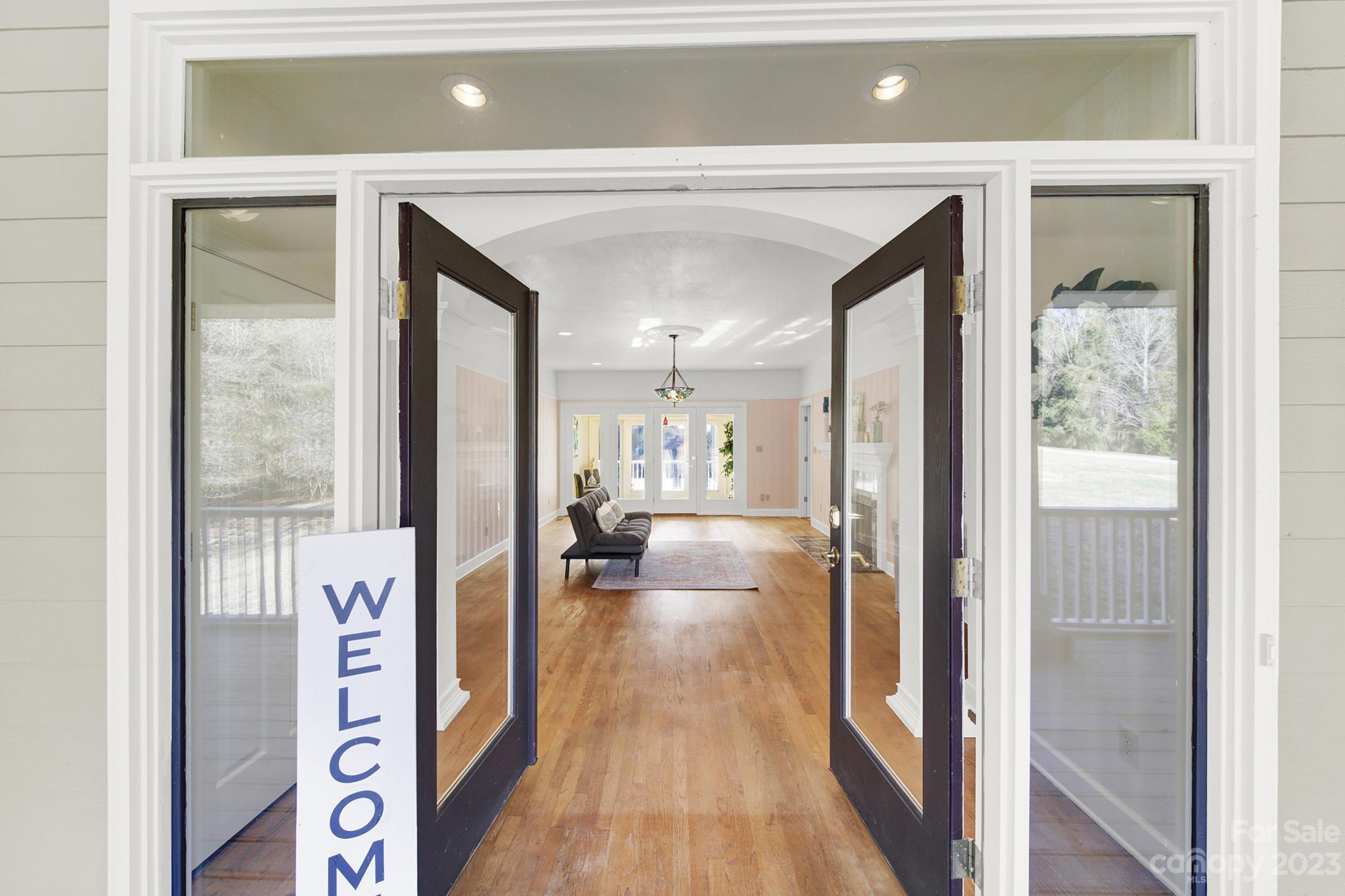 4594 Reid Road Rock Hill, SC 29730 - Photo 3 of 48 a view of a hallway view with wooden floor and living room