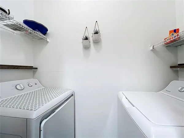 a utility room with dryer and washer