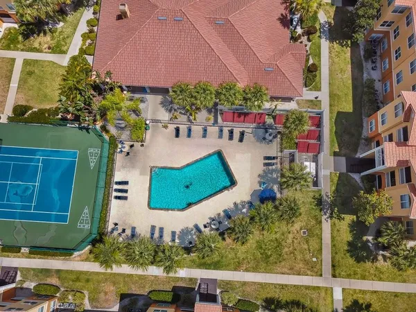 an aerial view of multiple houses with yard