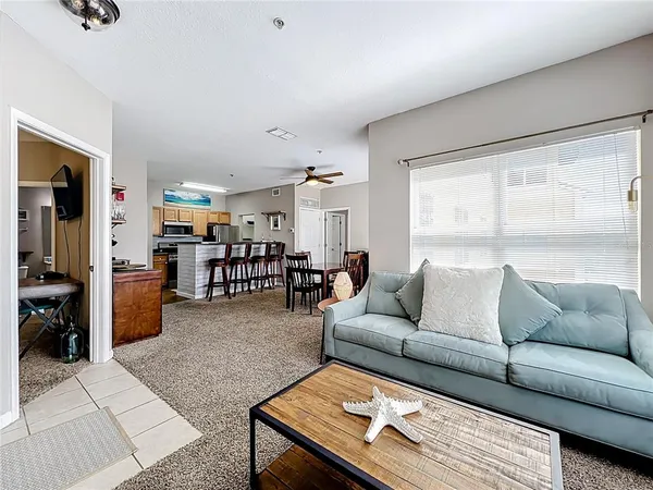 a living room with furniture and a large window