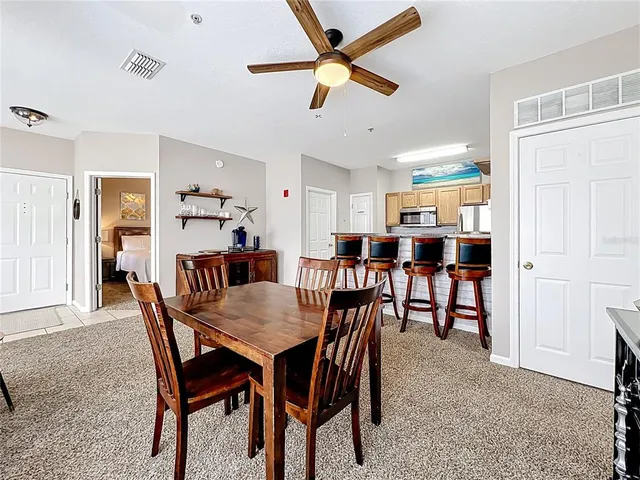 a dining room with furniture and window