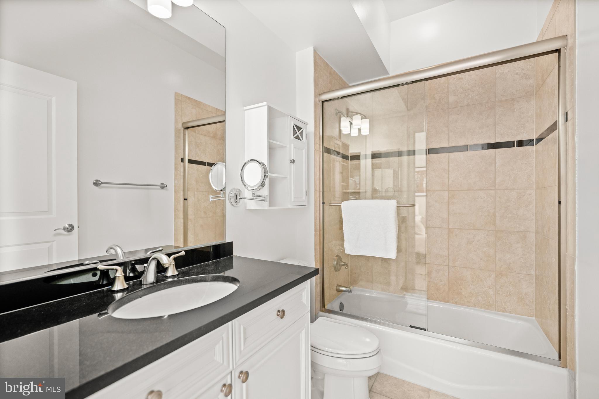 1210 R Street Northwest, Unit 213 Washington, DC 20009 - Photo 10 of 14 a bathroom with a sink and a mirror