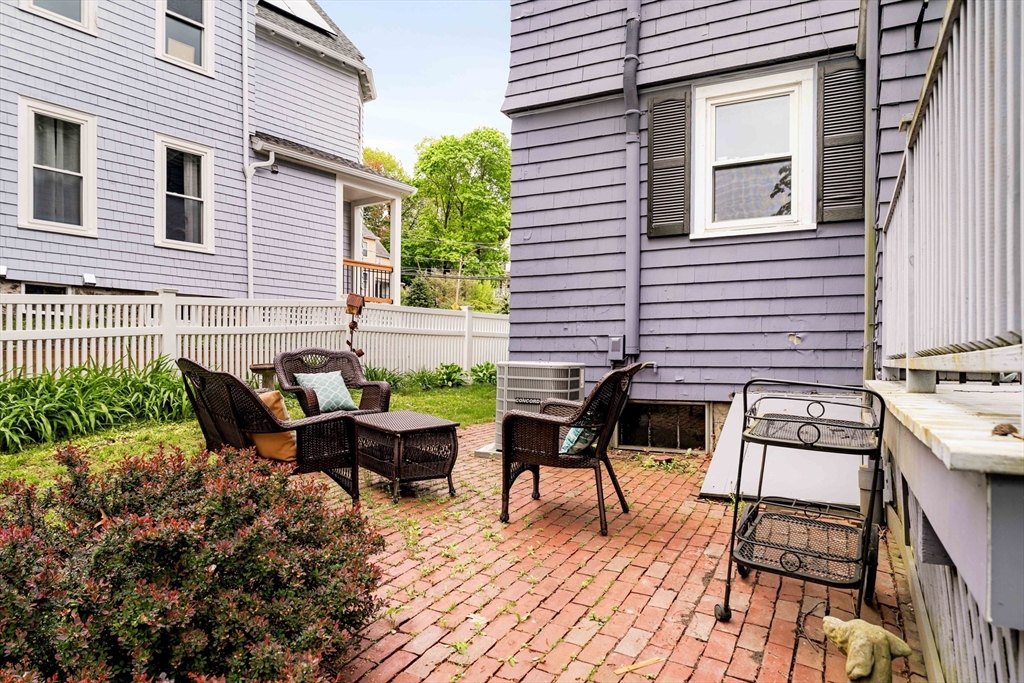 52 Walter Street Boston, MA 02131 - Photo 29 of 31 a view of a patio with chairs and a table
