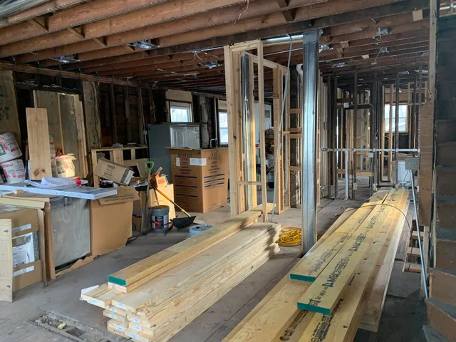 a view of a patio with dining table and chairs