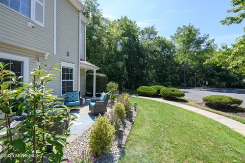 a view of backyard with seating space
