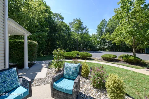 a view of backyard with swimming pool and outdoor seating