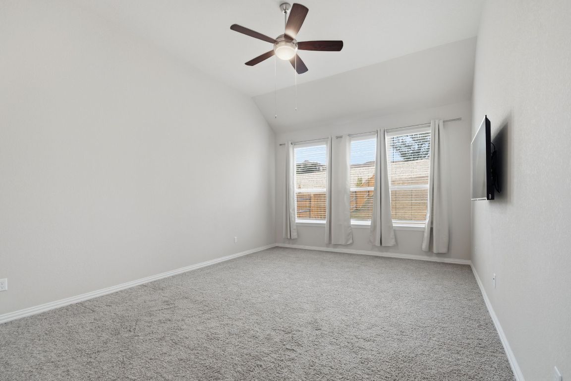 1009 Calendula Trail Georgetown, TX 78628 - Photo 14 of 31 an empty room with windows and fan