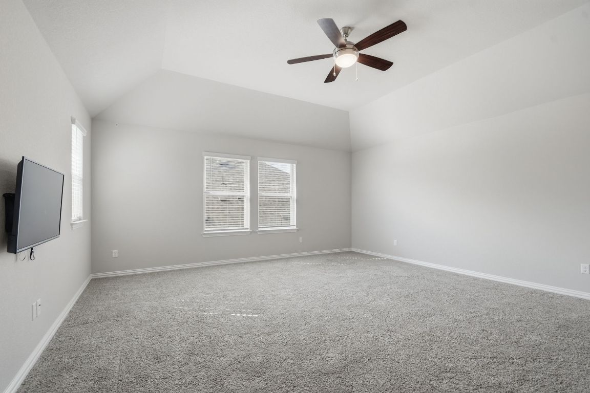 1009 Calendula Trail Georgetown, TX 78628 - Photo 22 of 31 an empty room with windows and fan