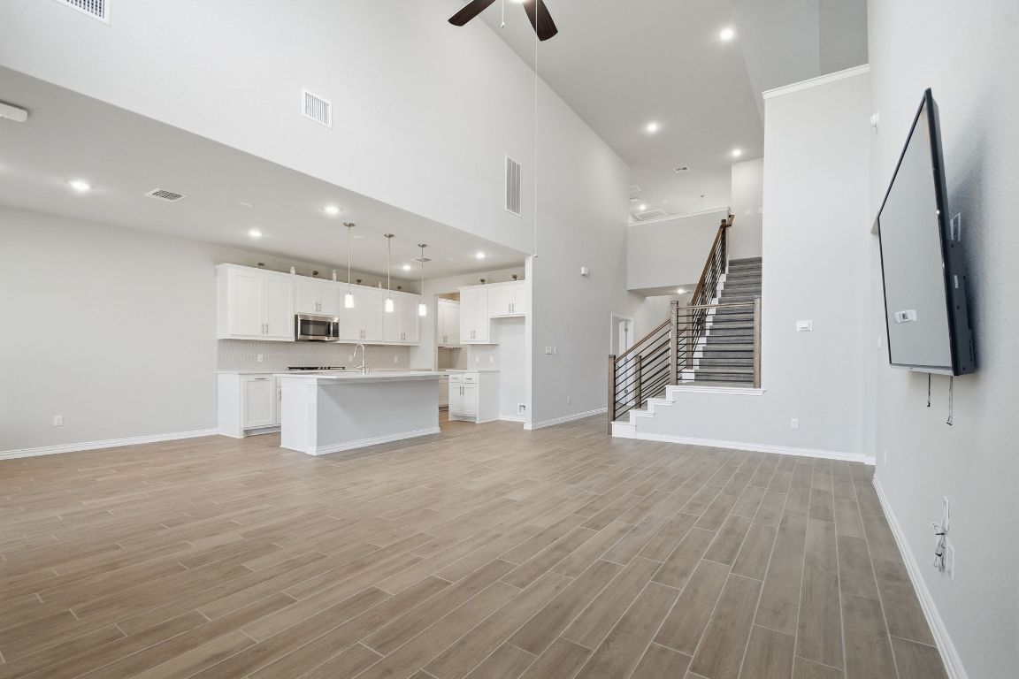 1009 Calendula Trail Georgetown, TX 78628 - Photo 3 of 31 a view of kitchen with sink and refrigerator
