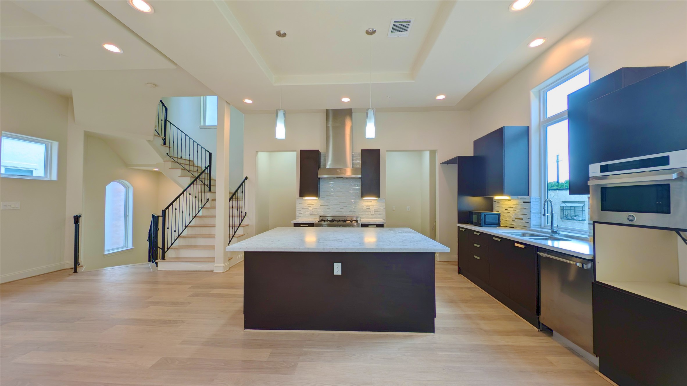 1844 Colquitt Street Houston, TX 77098 - Photo 11 of 40 a large kitchen with stainless steel appliances kitchen island granite countertop a large counter top and stove