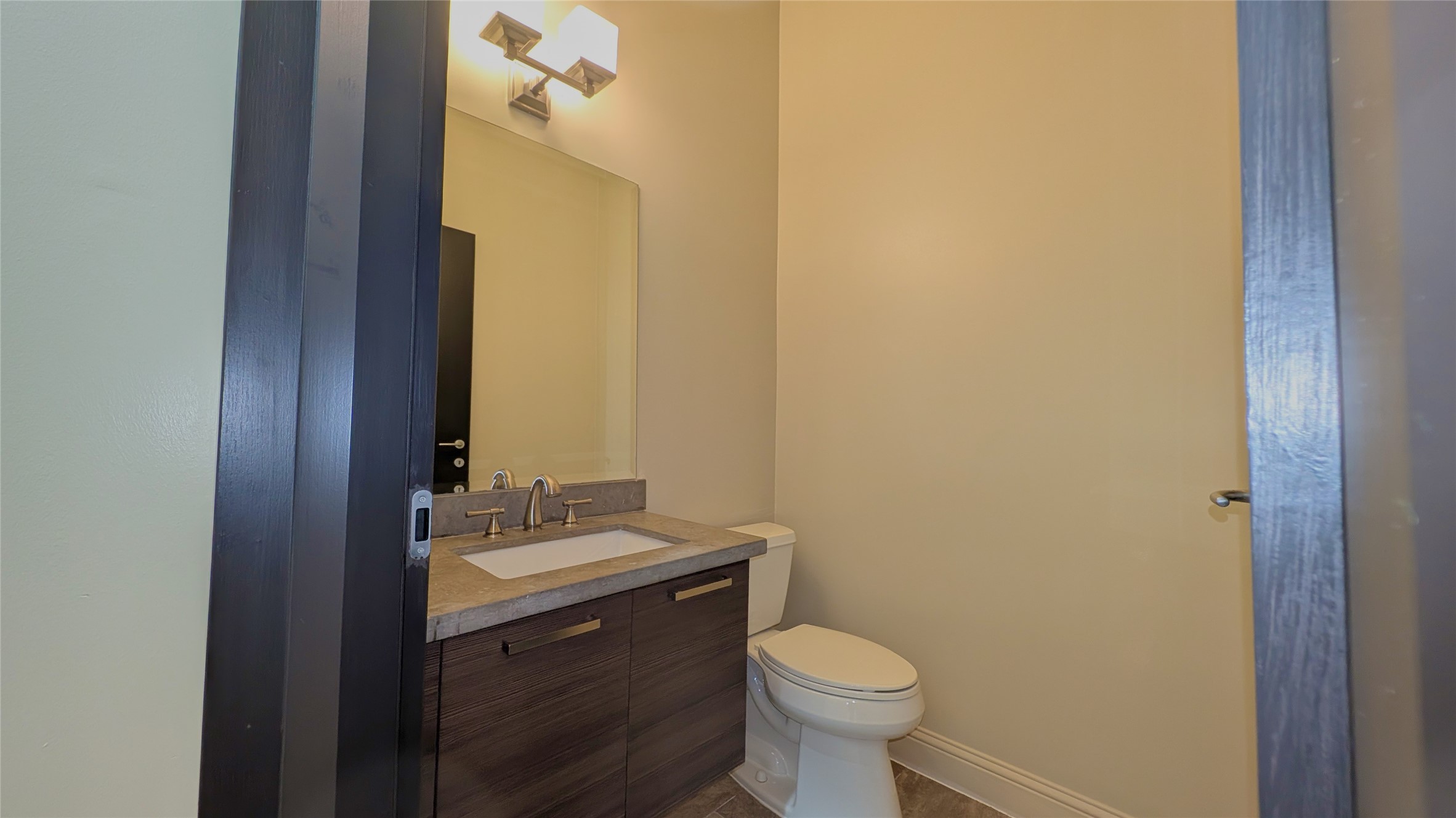 1844 Colquitt Street Houston, TX 77098 - Photo 13 of 40 a bathroom with a sink and a mirror