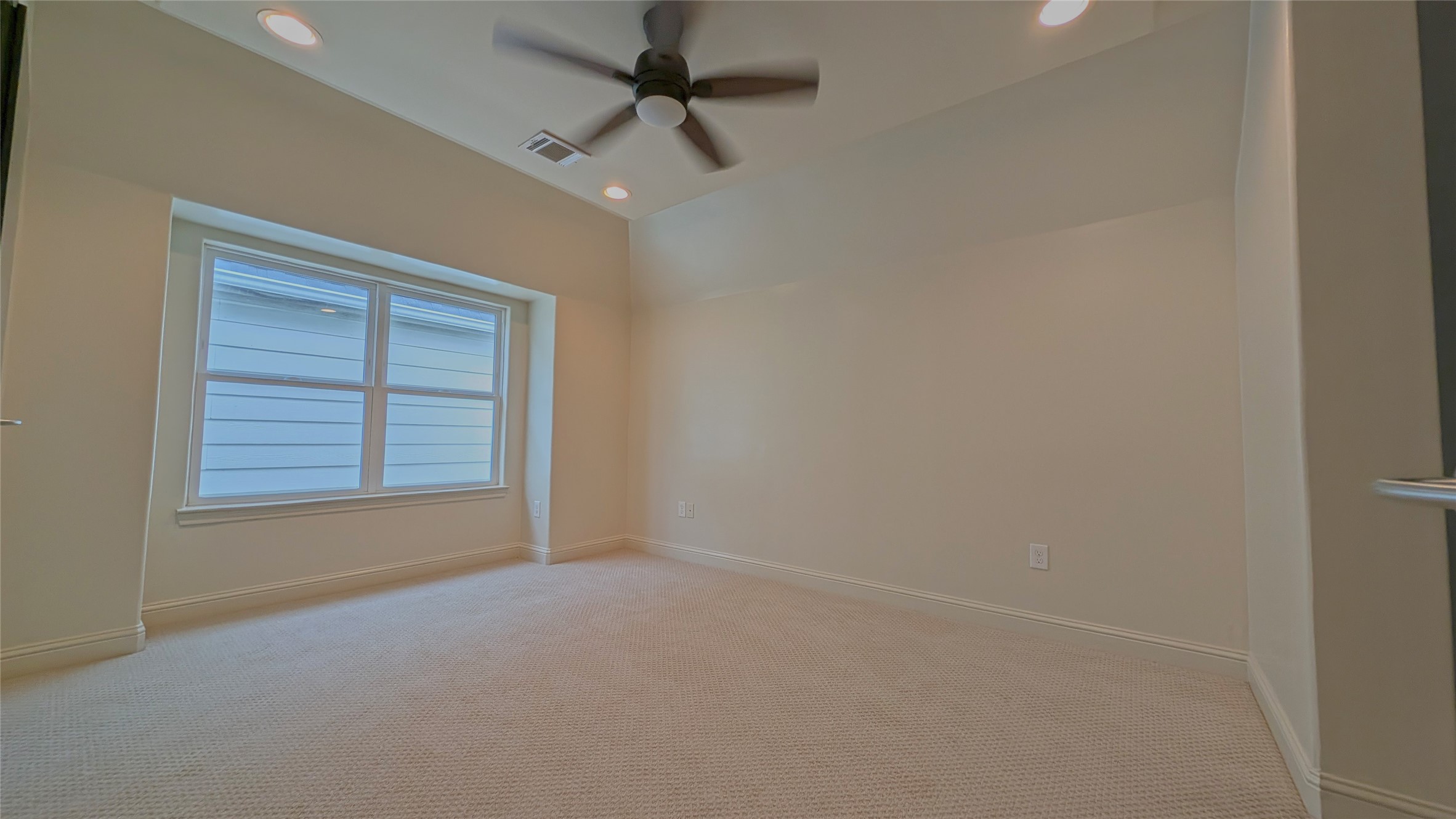 1844 Colquitt Street Houston, TX 77098 - Photo 35 of 40 an empty room with a window and a fan