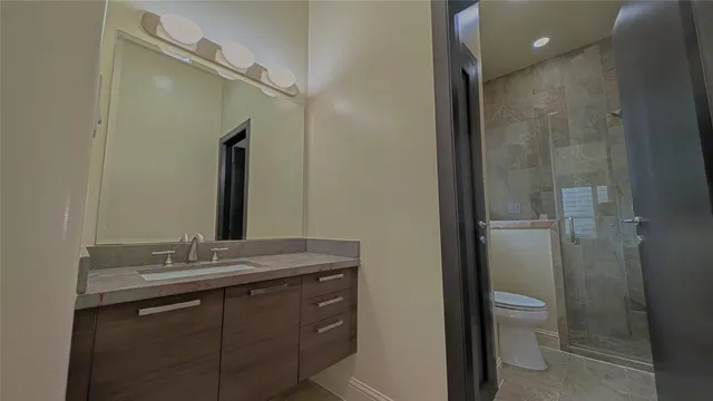 a large kitchen with a large counter top appliances and cabinets