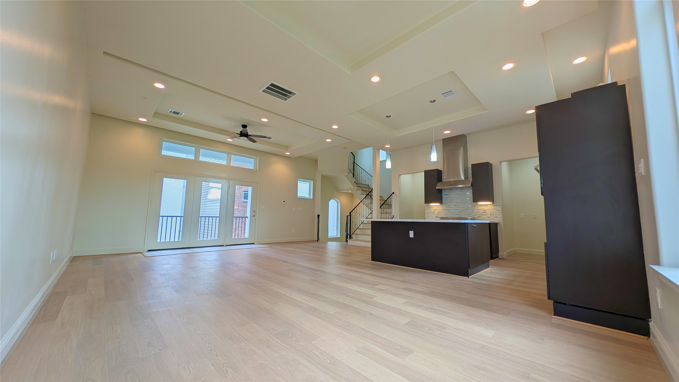 1844 Colquitt Street Houston, TX 77098 - Photo 10 of 40 a view of a living room a refrigerator and a wooden floor