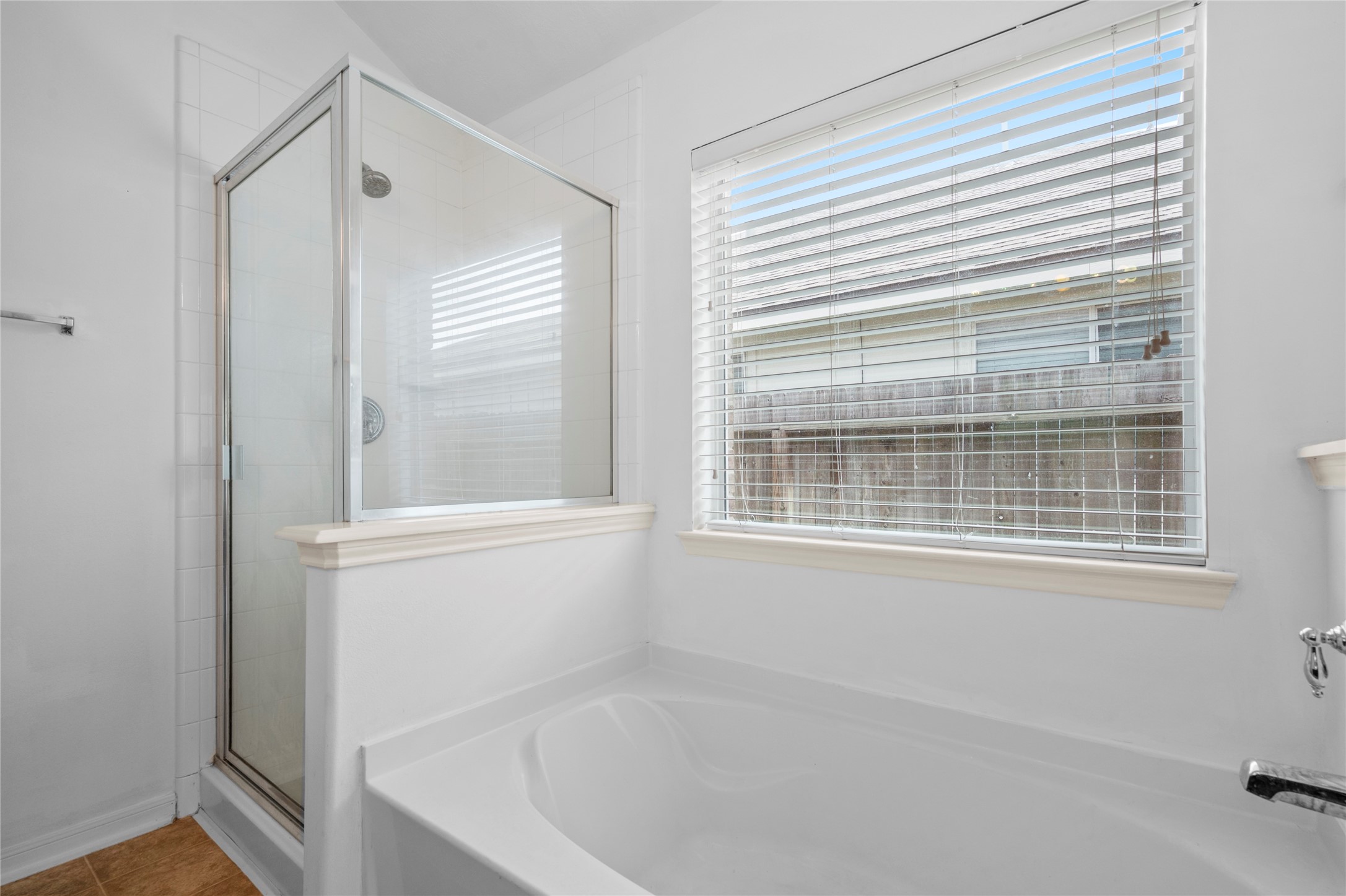 25211 Bluma Ranch Drive Katy, TX 77494 - Photo 15 of 22 a bathroom with a bathtub and a window