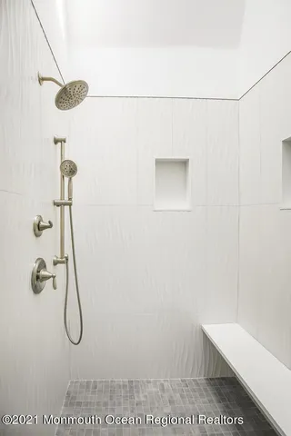 a bathroom with a shower and a sink