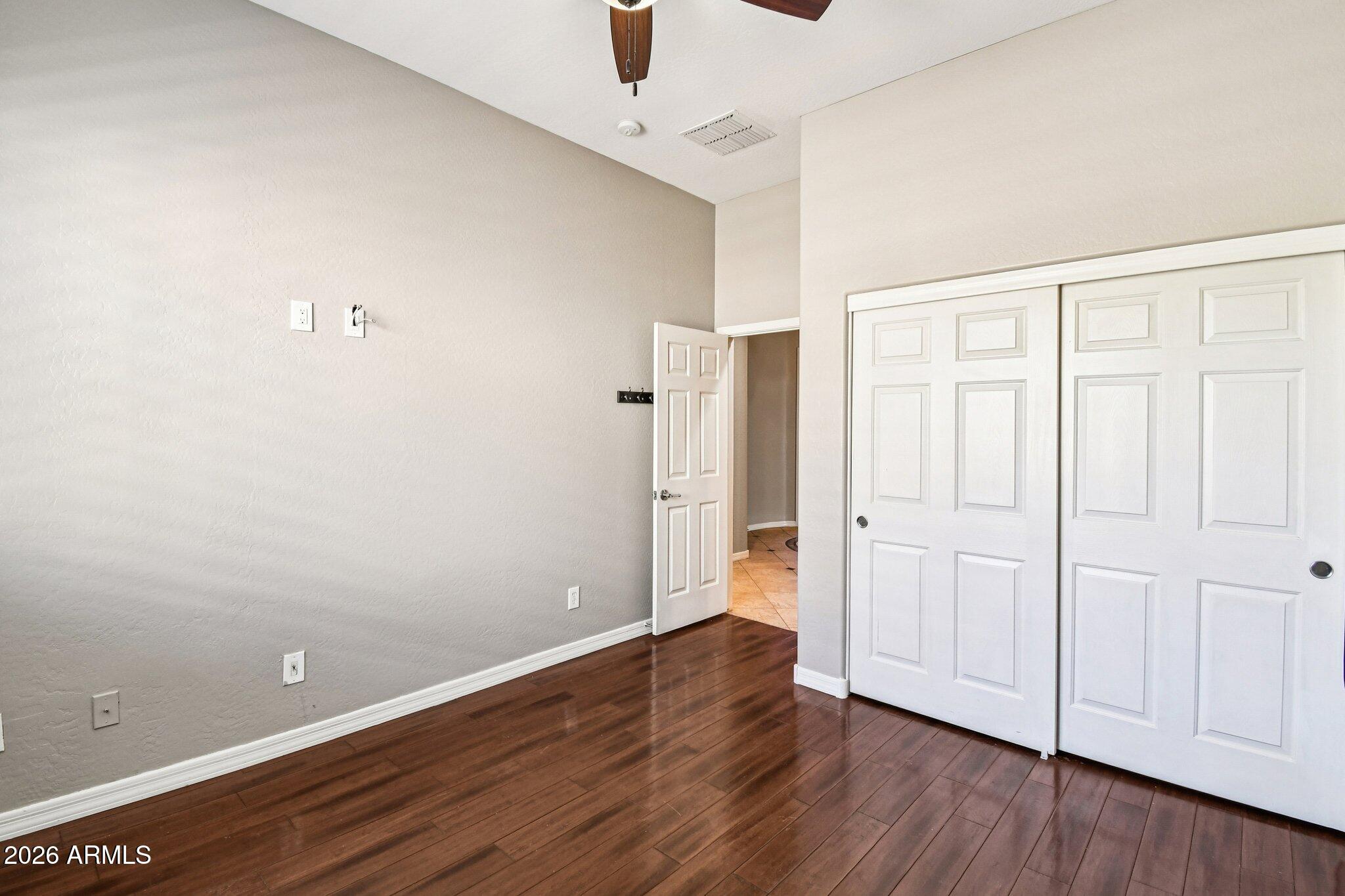 4825 West Cavalry Road Anthem, AZ 85087 - Photo 39 of 60 an empty room with wooden floor