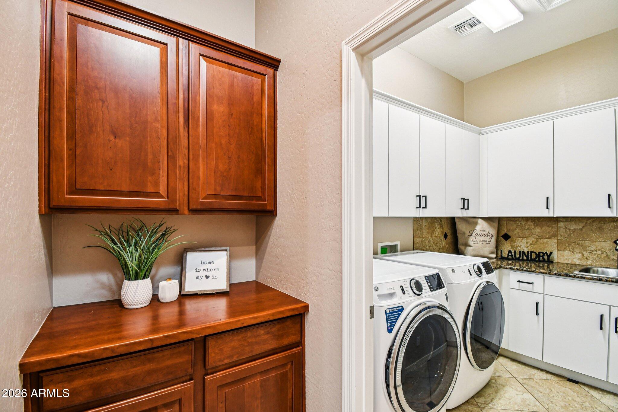 4825 West Cavalry Road Anthem, AZ 85087 - Photo 40 of 60 a view of kitchen with stainless steel appliances granite countertop cabinets and a potted plant