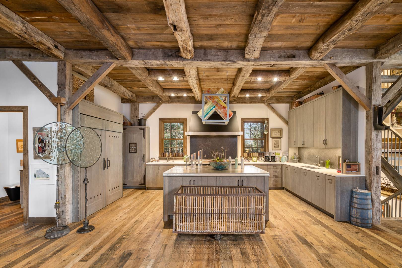 675 Flying Point Road Water Mill, NY 11976 - Photo 24 of 47 a living room with furniture and a chandelier