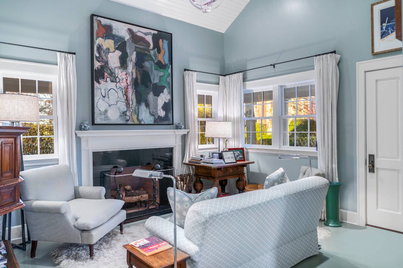 675 Flying Point Road Water Mill, NY 11976 - Photo 39 of 47 a living room with furniture a fireplace and a large window