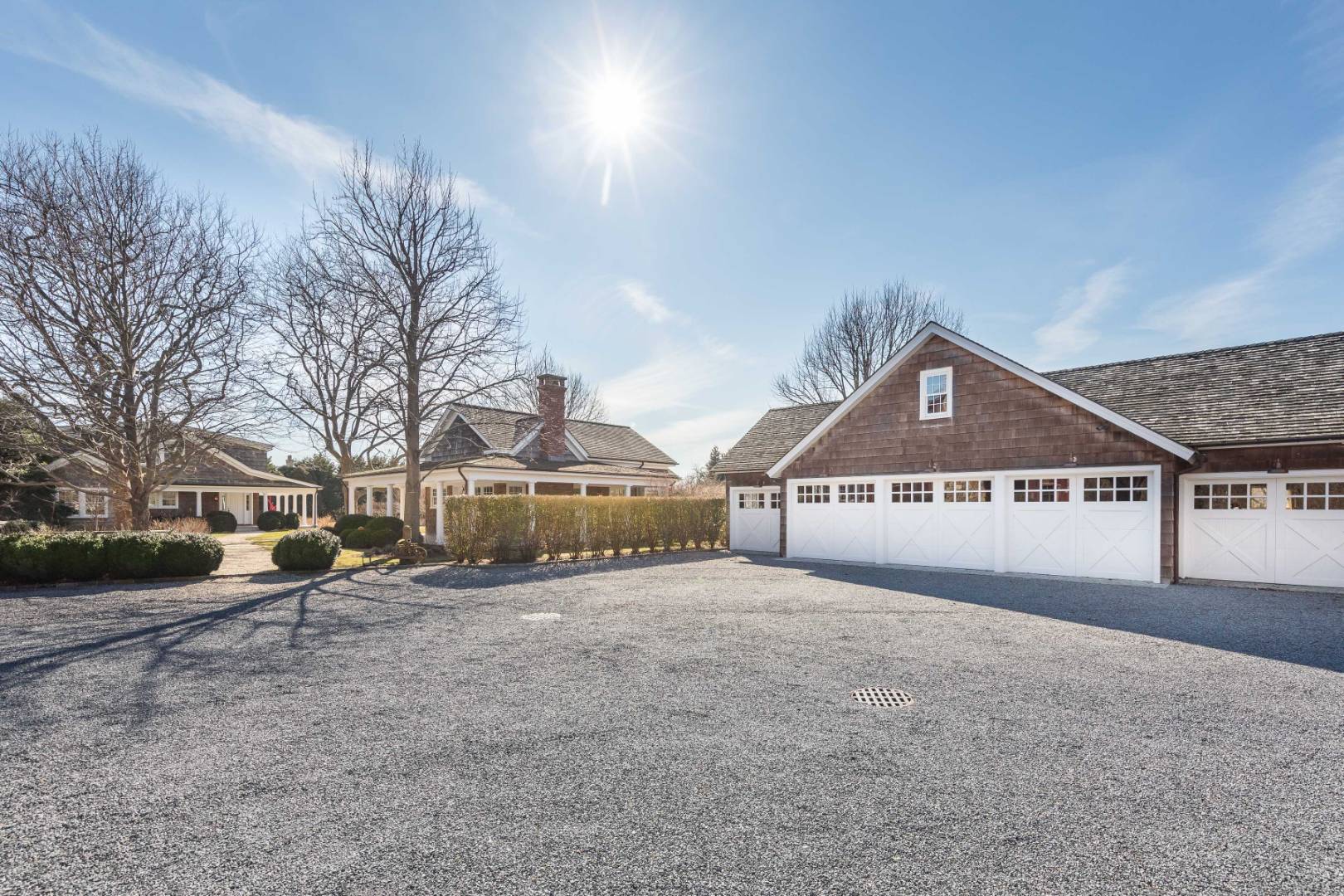 675 Flying Point Road Water Mill, NY 11976 - Photo 5 of 47 front view of a house next to a big yard