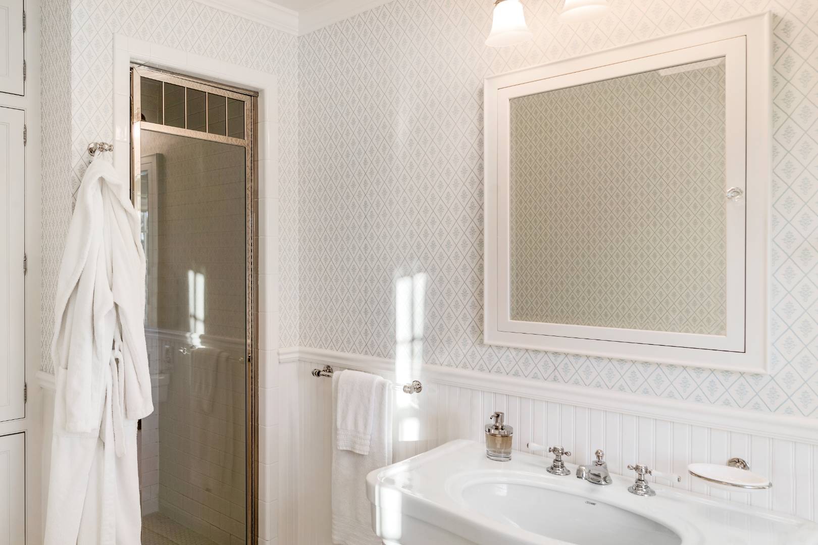 675 Flying Point Road Water Mill, NY 11976 - Photo 41 of 47 a bathroom with a sink and a mirror
