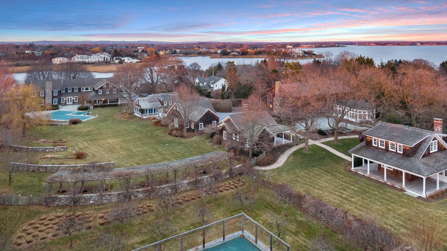 675 Flying Point Road Water Mill, NY 11976 - Photo 9 of 47 an aerial view of residential houses with outdoor space