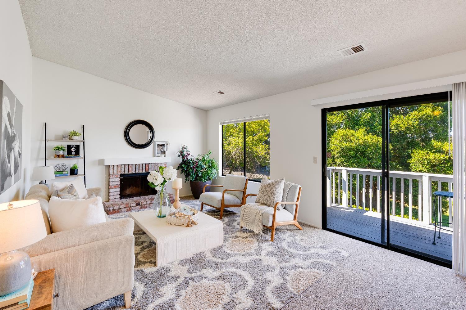 2000 Clearview Circle Benicia, CA 94510 - Photo 13 of 33 a living room with fireplace furniture and a large window