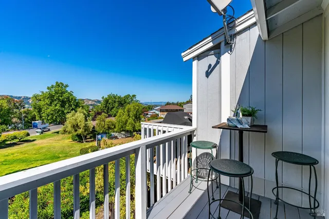 a view of a balcony with furniture