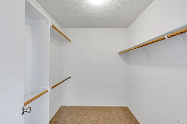 a bathroom with a sink a toilet a shower and a mirror